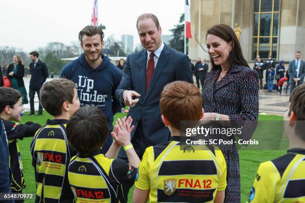 Britain's Catherine, Duchess of Cambridge and Prince William, Duke of Cambridge meet young Rugby players during the 'Les Voisins in Action' event...