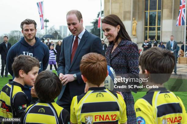 Britain's Catherine, Duchess of Cambridge and Prince William, Duke of Cambridge meet young Rugby players during the 'Les Voisins in Action' event...