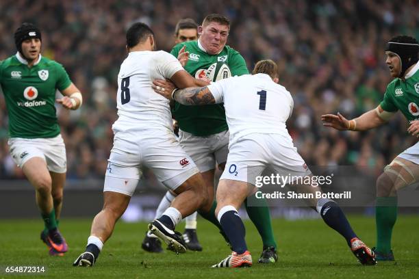 Tadhg Furlong of Ireland is tackled by Billy Vunipola and Joe Marler of England during the RBS Six Nations match between Ireland and England at the...