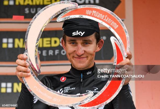Poland's Michal Kwiatkowski celebrates on the podium after winning the 108th edition of the Milan - San Remo cycling race, on March 18, 2017 in San...