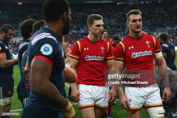 Sam Warburton and George North walk past Noa Nakaitaci of France after their sides 18-20 defeat during the RBS Six Nations match between France and...