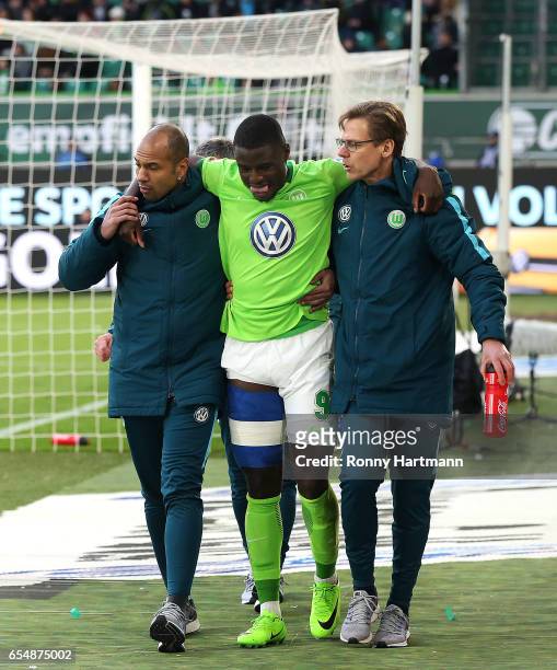 Paul-Georges Ntep of Wolfsburg leaves the pitch with an injury during the Bundesliga match between VfL Wolfsburg and SV Darmstadt 98 at Volkswagen...