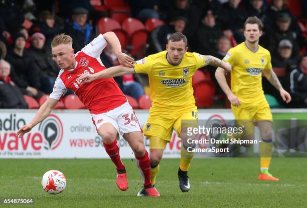Fleetwood Town's Kyle Dempsey gets away from AFC Wimbledon's Andy Barcham during the Sky Bet League One match between Fleetwood Town and AFC...
