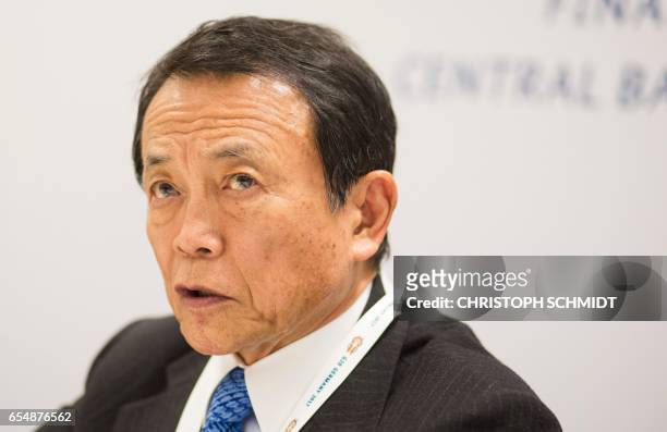 Japanase Finance Minister Taro Aso attends a press conference during the G20 Finance Ministers and Central Bank Governors Meeting in Baden-Baden,...