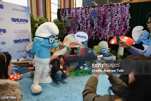 Kids pose with Smurfs at the United Nations Headquarters celebrating International Day of Happiness in conjunction with SMURFS: THE LOST VILLAGE on...