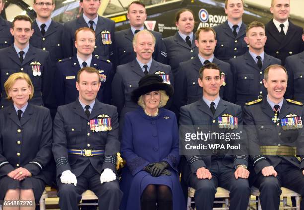 Camilla, Duchess of Cornwall poses for a group picture with pilots and other staff during a visit to RAF Leeming for the 100 Squadron Centenary on...