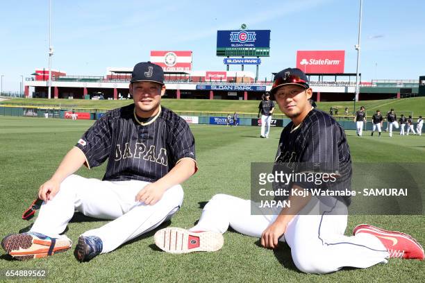 Sho Nakata and Yoshitomo Tsutsugoh of Japan looks on during the exhibition game between Japan and Chicago Cubs at Sloan Park on March 18, 2017 in...