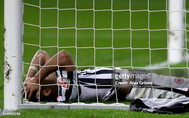 Marco Fabian of Frankfurt lies dejected in the goal during the Bundesliga match between Eintracht Frankfurt and Hamburger SV at Commerzbank-Arena on...
