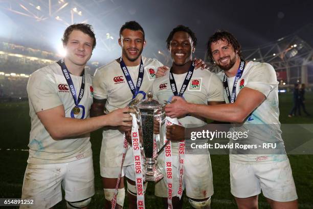 Joe Launchbury, Courtney Lawes, Maro Itoje and Tom Wood of England celebrate with the Six Nations trophy during the RBS Six Nations match between...