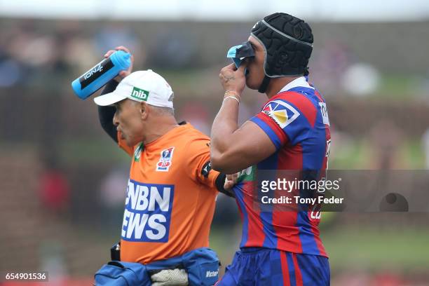 Sione Mata' Utia of the Knights leaves the ground after getting injured during the round three NRL match between the Newcastle Knights and the South...