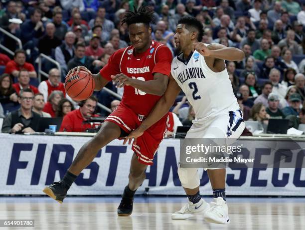 Nigel Hayes of the Wisconsin Badgers drives to the basket against Kris Jenkins of the Villanova Wildcats during the second round of the 2017 NCAA...