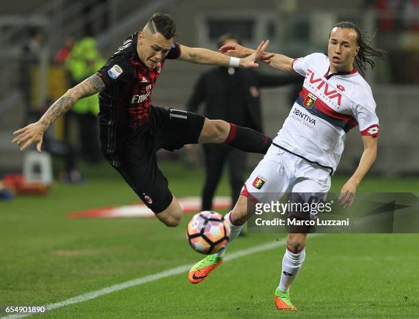 Lucas Ocampos of AC Milan competes for the ball with Diego Laxalt of Genoa CFC during the Serie A match between AC Milan and Genoa CFC at Stadio...