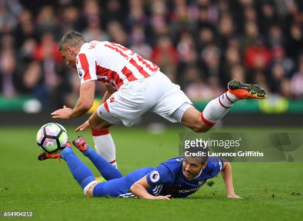 Pedro of Chelsea battles for the ball with Jonathan Walters of Stoke City during the Premier League match between Stoke City and Chelsea at Bet365...