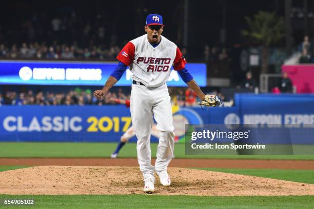 Puerto Rico Pitcher Edwin Diaz reacts to striking out USA Second baseman Josh Harrison to end the game. Puerto Rico defeated USA 6-5 in a World...