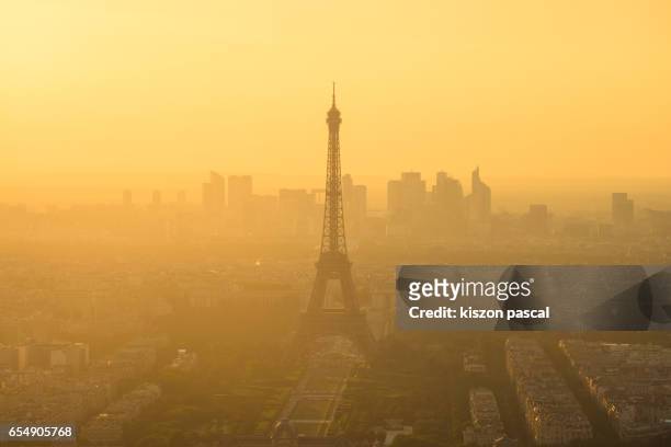aerial view of eiffel tower during a foggy day , paris , france - air pollution stock pictures, royalty-free photos & images