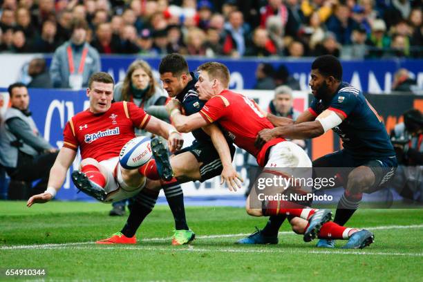 France's winger Virimi Vakatawa , Wales' Liam Williams , France's fullback Brice Dulin and another Wale's player during the Six Nations tournament...