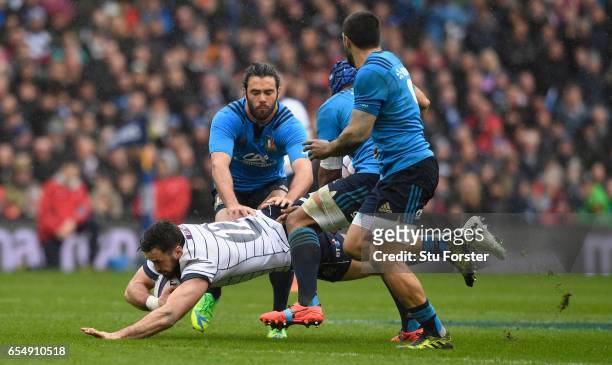 Scotland player Alex Dunbar is upended during the RBS Six Nations match between Scotland and Italy at Murrayfield Stadium on March 18, 2017 in...