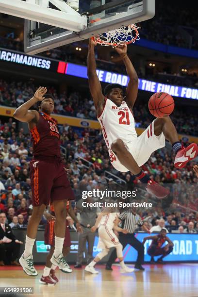 Wisconsin Badgers guard Khalil Iverson dunks on Virginia Tech Hokies forward Zach LeDay during the NCAA Division 1 Men's Basketball Championship game...