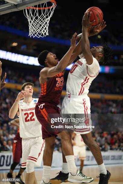 Wisconsin Badgers guard Bronson Koenig is fouled by Virginia Tech Hokies forward Zach LeDay during the NCAA Division 1 Men's Basketball Championship...