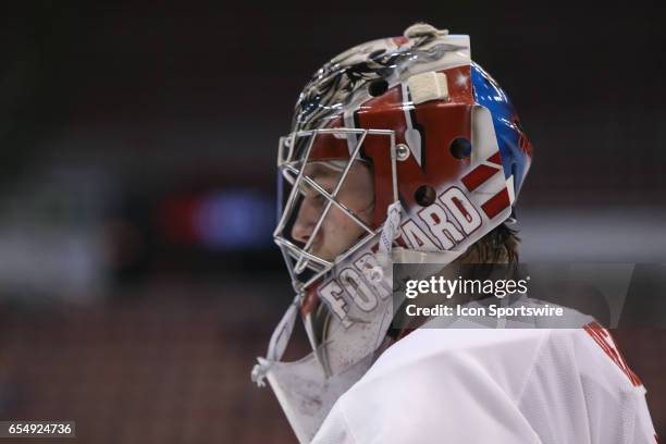 Wisconsin Badgers goalie Jack Berry looks on during the first period of a Big 10 Men's Ice Hockey Tournament semifinal game between Ohio State and...