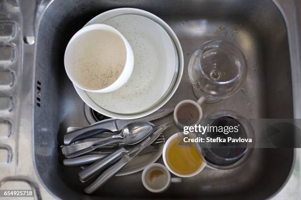 directly from above shot of dirty dishes in kitchen sink - dirty sink stock pictures, royalty-free photos & images