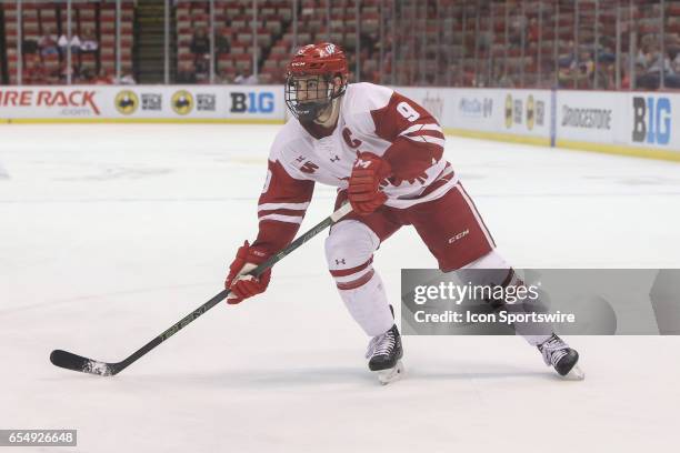 Wisconsin Badgers forward Luke Kunin skates during the second period of a Big 10 Men's Ice Hockey Tournament semifinal game between Ohio State and...