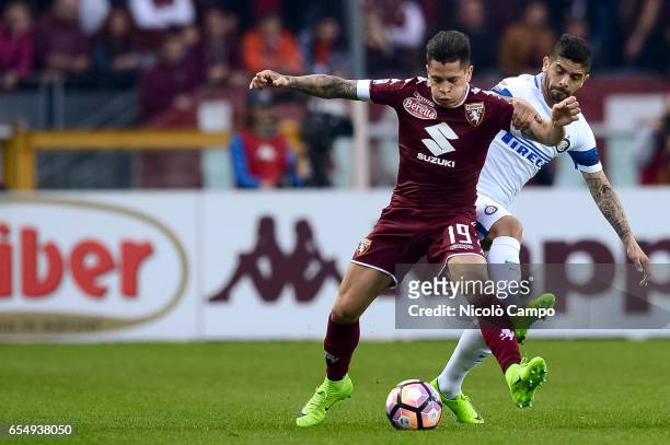 Juan Manuel Iturbe of Torino FC and Ever Banega of FC Internazionale compete for the ball during the Serie A football match between Torino FC and FC...