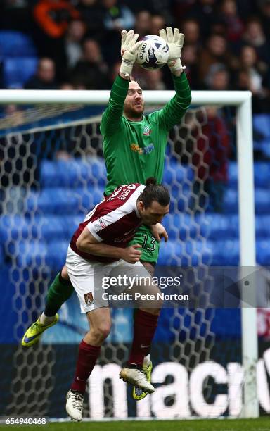 Ben Alnwick of Bolton Wanderers collects the ball under pressure from John-Joe O'Toole of Northampton Town during the Sky Bet League One match...