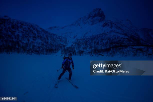 An athlete ski trough the night to reach the finishline on March 18, 2017 in Svolvar, Norway. The Arctic Triple - Lofoten Skimo is the first of three...