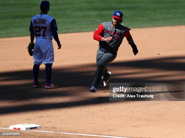Mike Aviles of Team Puerto Rico rounds the bases to score in the top of the seventh inning of Game 5 of Pool F of the 2017 World Baseball Classic...