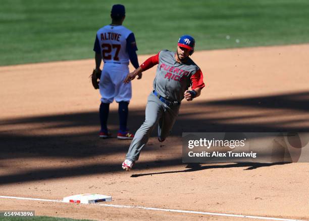 Mike Aviles of Team Puerto Rico rounds the bases to score in the top of the seventh inning of Game 5 of Pool F of the 2017 World Baseball Classic...