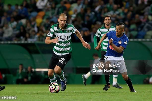 Sportings forward Bas Dost from Holland and Nacionals defender Victor Garcia from Venezuela during Premier League 2016/17 match between Sporting CP...