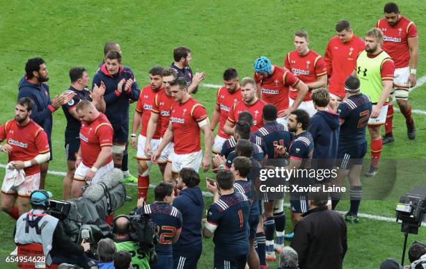 Players of France celebrate the victory and Wales players are disapointed after the RBS Six Nations match between France and Wales at Stade de France...