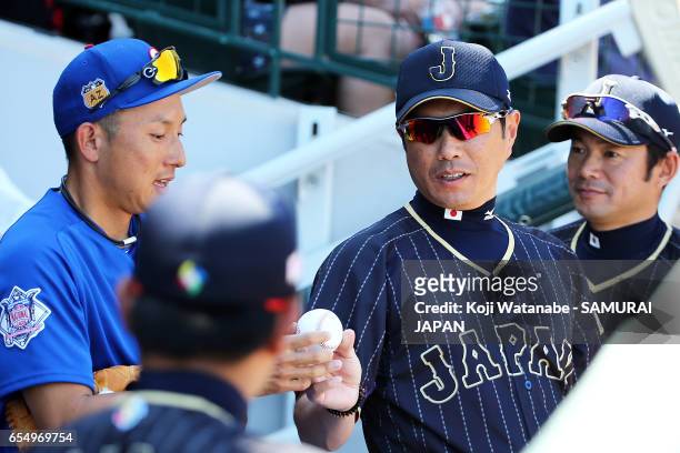 Manager Hiroki Kokubo of Japan and Munenori Kawasaki of Chicago Cubsin speke on during the exhibition game between Japan and Chicago Cubs at Sloan...