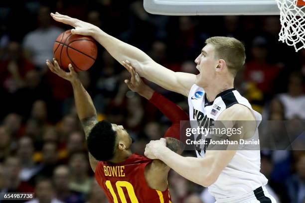 Isaac Haas of the Purdue Boilermakers blocks a shot attempt by Darrell Bowie of the Iowa State Cyclones in the first half during the second round of...