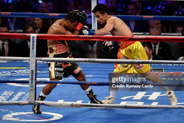 New York , United States - 18 March 2017; Roman Gonzalez, left, in action against Srisaket Sor Rungvisai during their super flyweight title bout at...