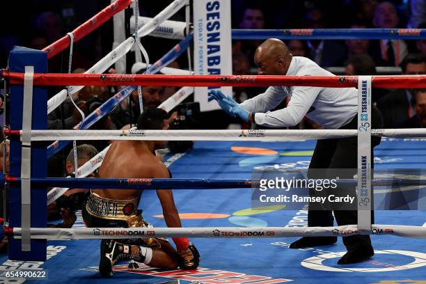 New York , United States - 18 March 2017; Roman Gonzalez recovers from a first round knock down by Srisaket Sor Rungvisai during their super...