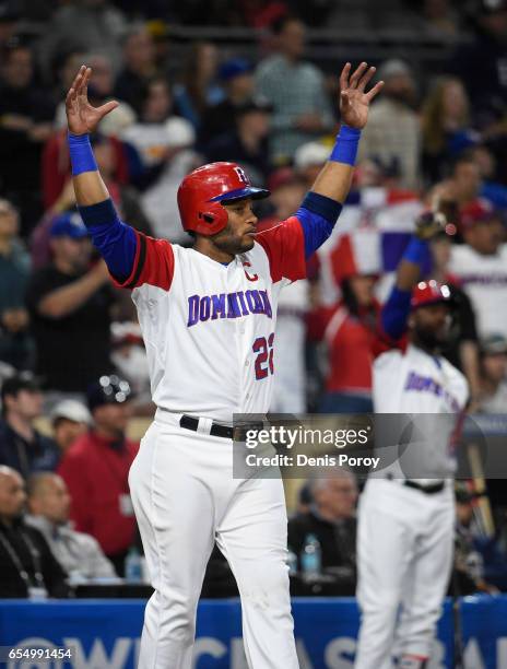 Robinson Cano of the Dominican Republic celebrates after scoring during the first inning of the World Baseball Classic Pool F Game Six between the...