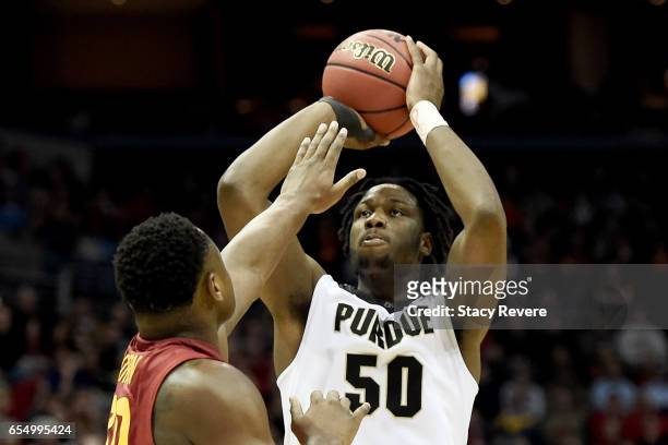 Caleb Swanigan of the Purdue Boilermakers attempts a shot while being guarded by Deonte Burton of the Iowa State Cyclones in the second half during...