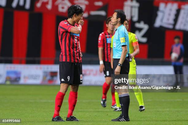 Ken Tokura of Consadole Sapporo talks to referee Hiroyuki Kimura during the J.League J1 match between Consadole Sapporo and Sanfrecce Hiroshima at...