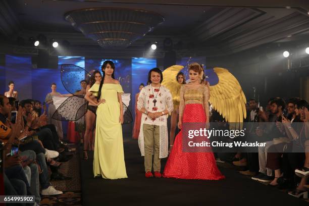 Keith Jackson walks the runway with Phapha Gachui & Urmila Shalgosem during India Intimate Fashion Week at Hotel Leela on March 18, 2017 in Mumbai,...