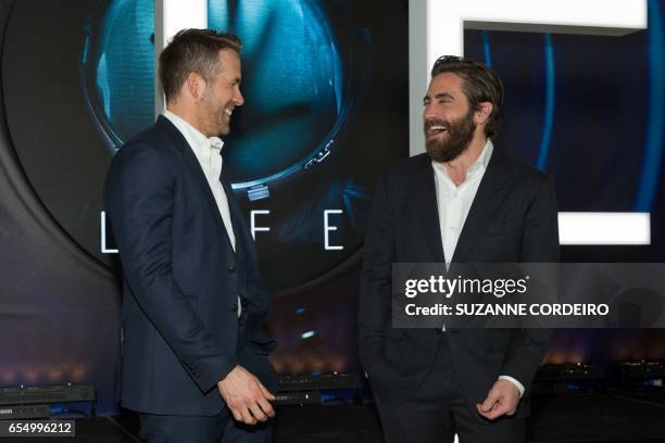 Actors Ryan Reynolds and Jake Gyllenhaal attend the premiere of the film 'Life' during the 2017 SXSW Conference and Festivals at the ZACH Theatre on...