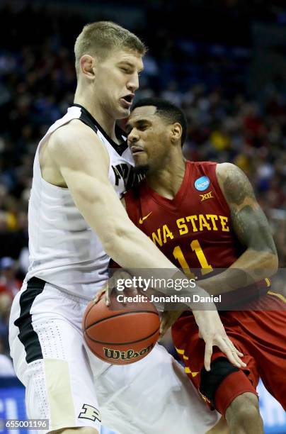 Isaac Haas of the Purdue Boilermakers knocks the ball away from Monte Morris of the Iowa State Cyclones in the second half during the second round of...