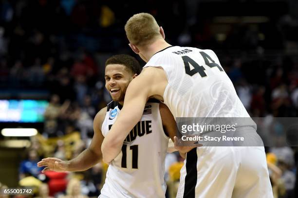 Thompson and Isaac Haas of the Purdue Boilermakers celebrate after beating the Iowa State Cyclones 80-76 during the second round of the 2017 NCAA...