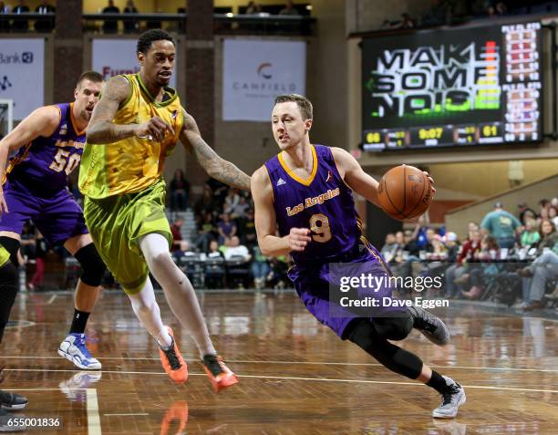 Josh Magette from the Los Angeles D-Fenders drives to the basket around Greg Whittington from the Sioux Falls Skyforce at the Sanford Pentagon March...