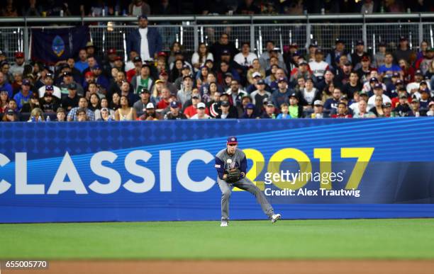 Christian Yelich of Team USA fields the ball in the bottom of the fourth inning of Game 6 of Pool F of the 2017 World Baseball Classic against Team...