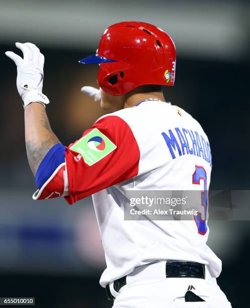 Manny Machado of Team Dominican Republic reacts after hitting a single in the bottom of the fifth inning of Game 6 of Pool F of the 2017 World...