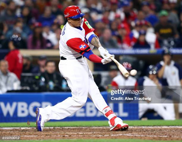 Manny Machado of Team Dominican Republic singles in the bottom of the fifth inning of Game 6 of Pool F of the 2017 World Baseball Classic against...