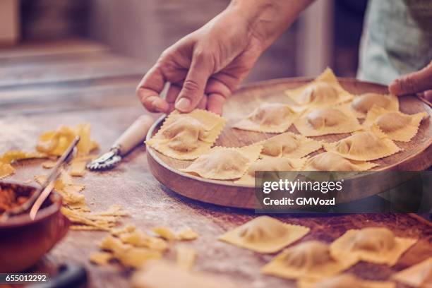 preparing homemade ravioli pasta - pasta making machine stock pictures, royalty-free photos & images