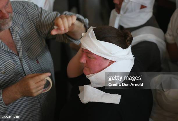 Woman has the finishing touches made to her costume at Powerhouse Museum on March 19, 2017 in Sydney, Australia. A total of 846 people wrapped...